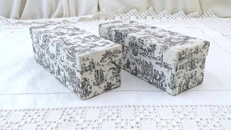 A French toile fabric scene