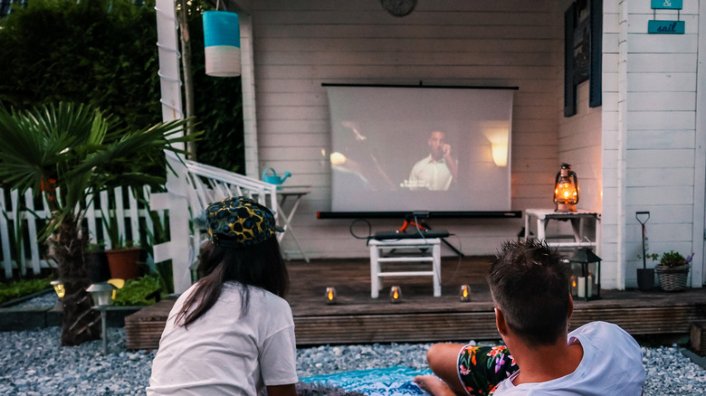 Couple with outdoor theatre room