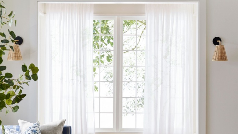 White whisper sheer curtain in light boho living room