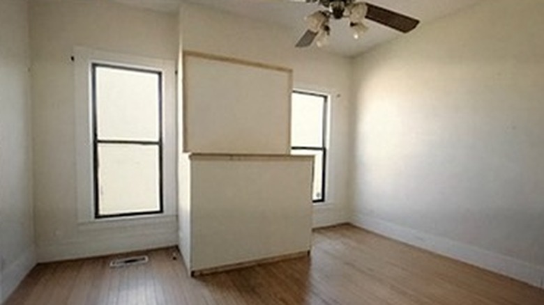 Plain bedroom with walled fireplace