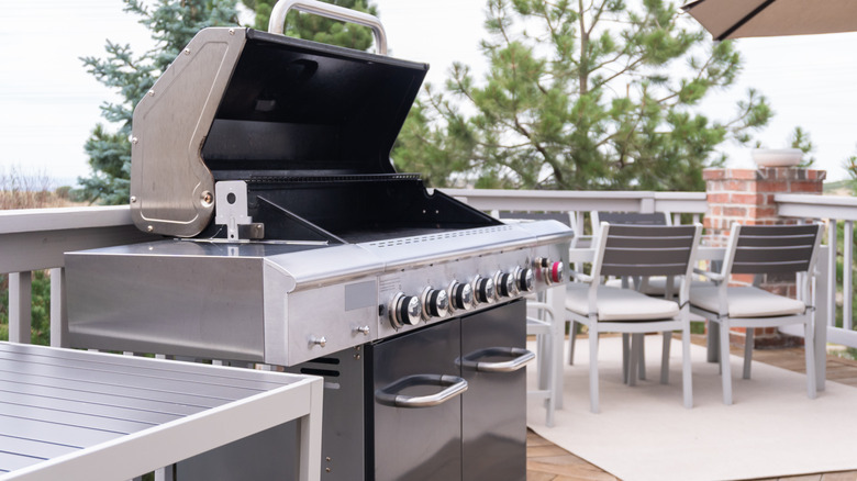 Modern grill in home backyard