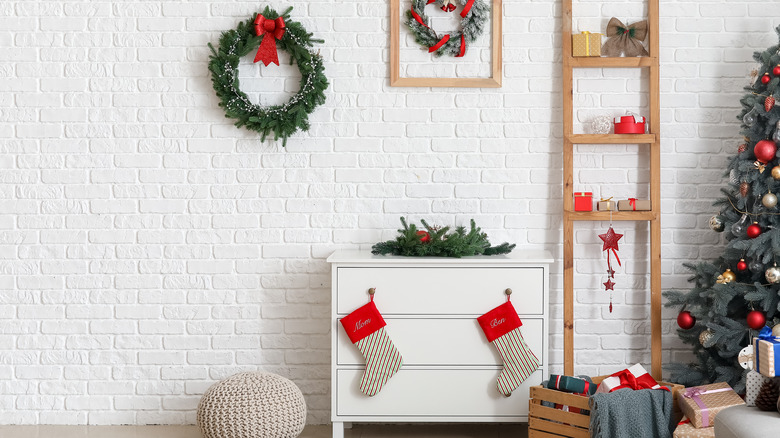 two stockings hung on dresser