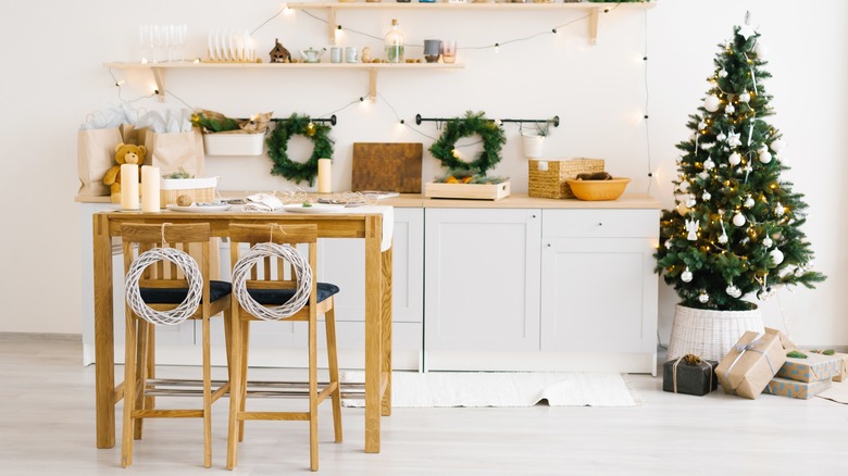 white wreaths on kitchen chairs