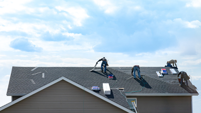 pro roofers fixing roof 