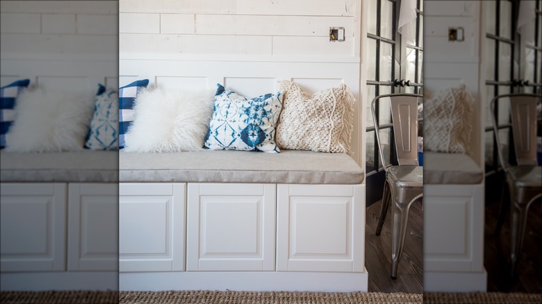 white bench seat with cabinets