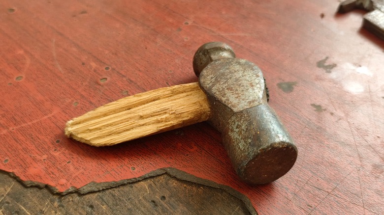 Broken hammer on work table