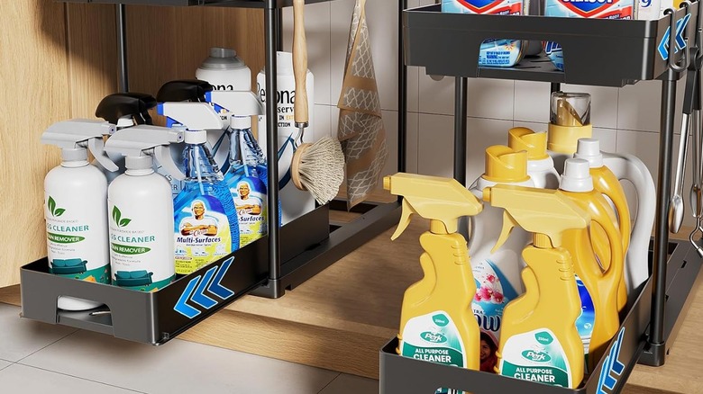 Two pull-out under the sink organizers with cleaning products