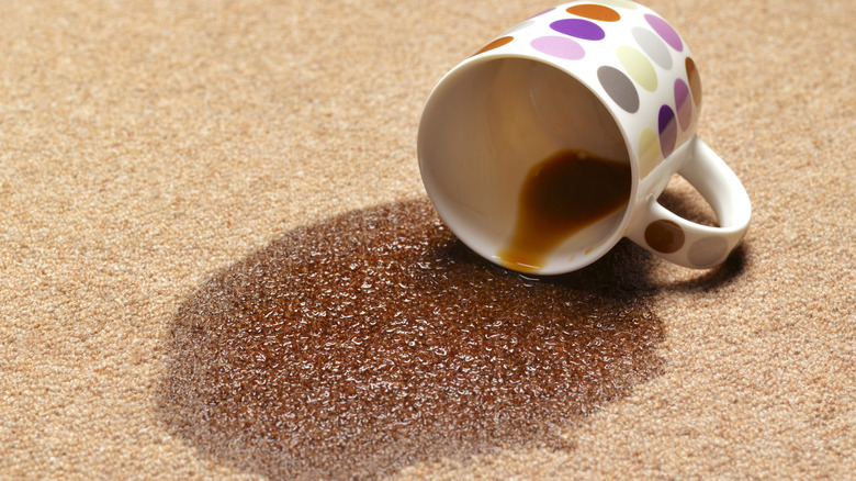 Spilled coffee mug on carpet