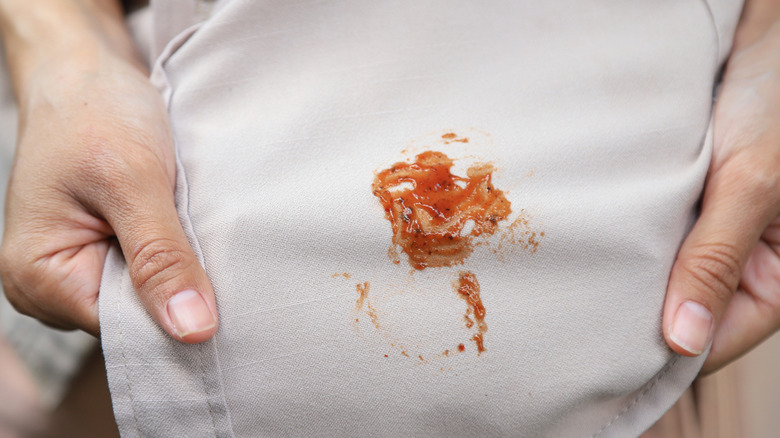 A red sauce stain on a shirt