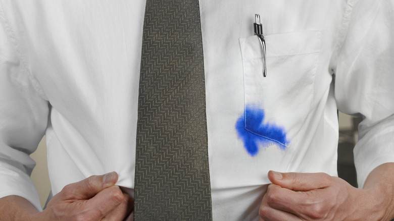 Man wearing shirt with ink stain in pocket