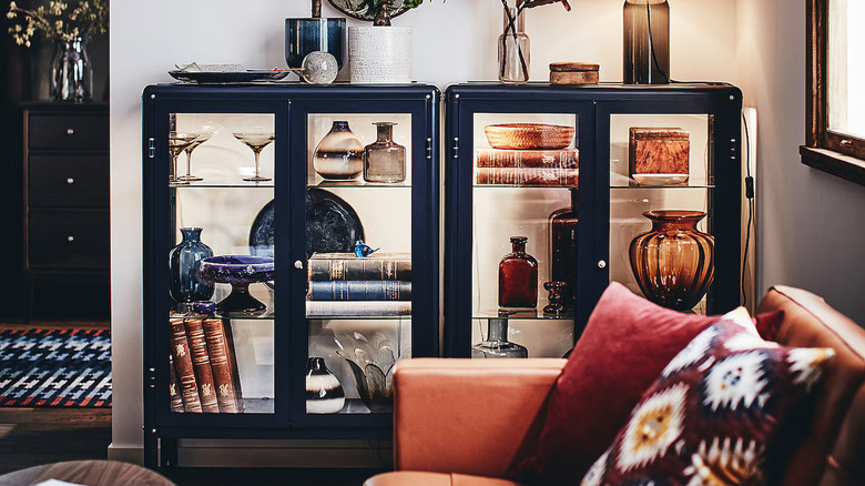 blue glass cabinets with decor