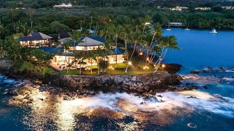 house with lights by the water