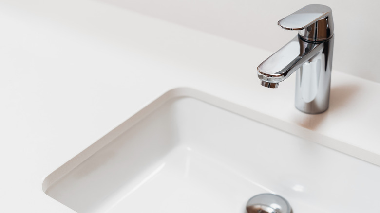 Bathroom sink with silver faucet