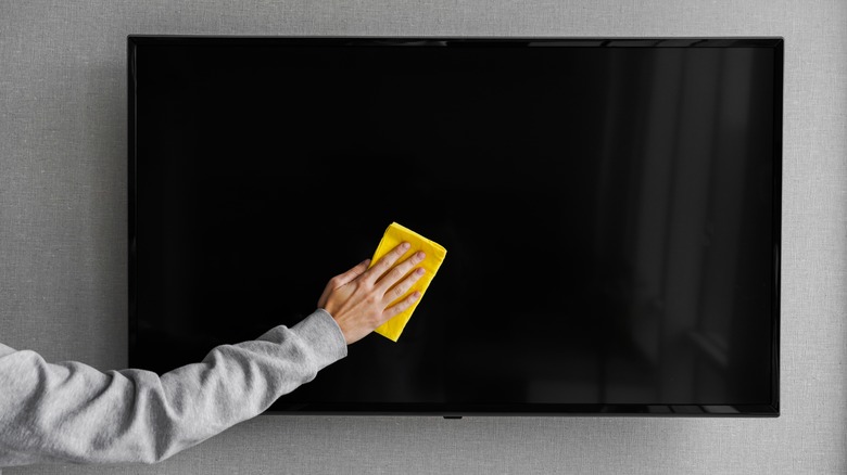 cleaning a TV