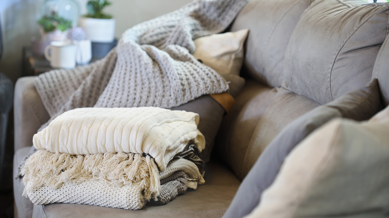 throw pillows and blankets on couch