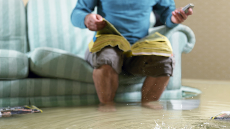 man in a flooded house