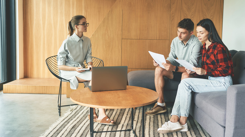 Couple meeting with landlord