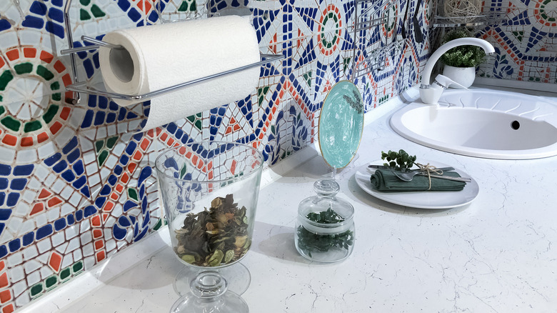 mosaic tiles behind a counter