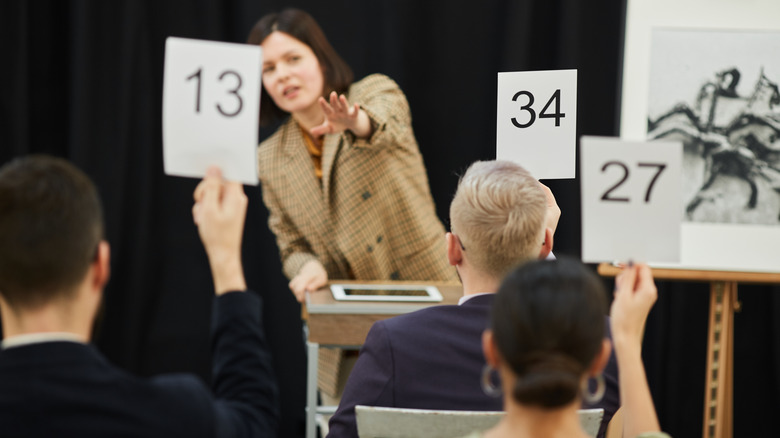 People bidding at an auction