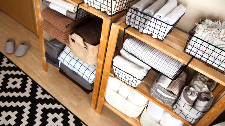 Bins with linens on shelves