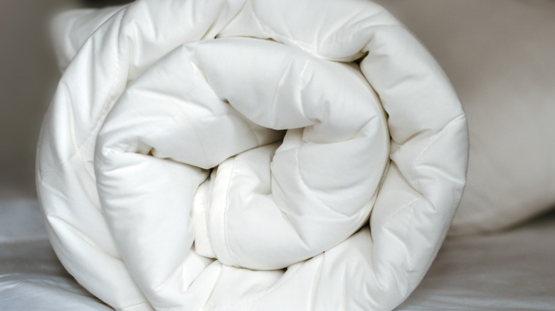 Rolled white comforter