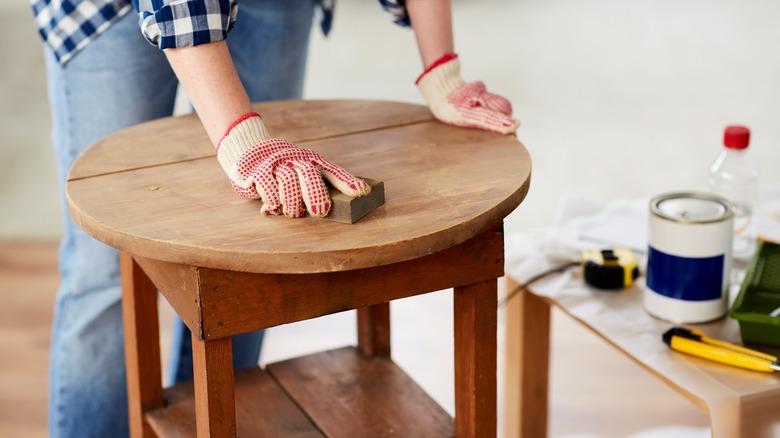 Person cleaning table