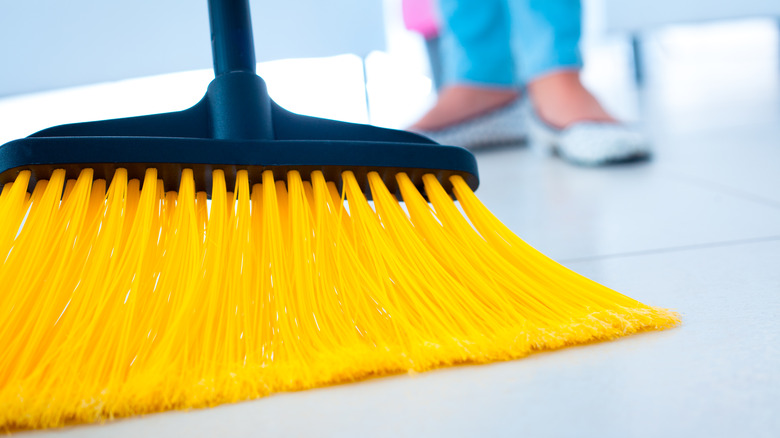 broom with yellow bristles 