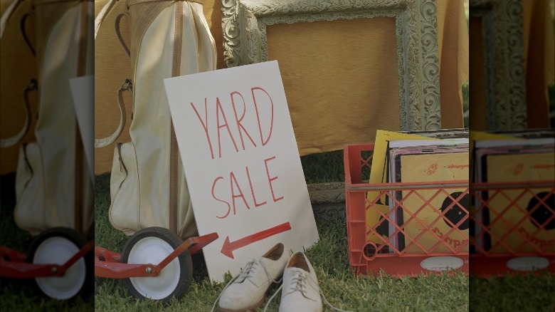 Yard aale sign with items