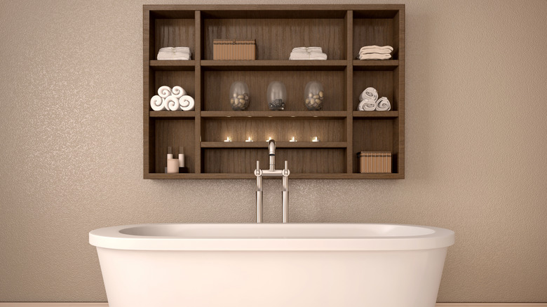 wooden shelf above white bathtub
