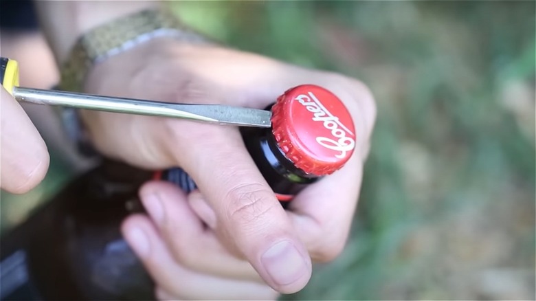 flathead screwdriver opening bottle cap