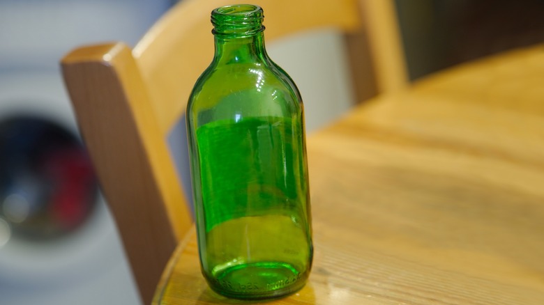 beer bottle on table edge