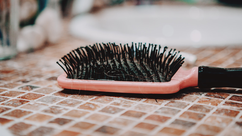 old hairbrush sitting on countertop