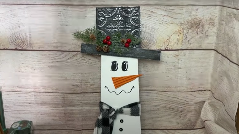 Ceiling fan blade decorated into cute snowman decor