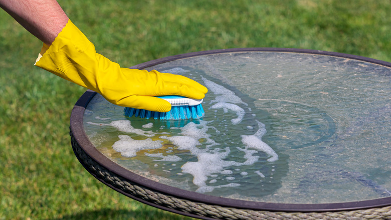 cleaning a glass patio table