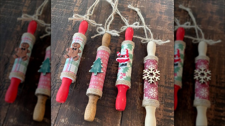 Mini rolling pins turned into Christmas ornaments laying flat on a table