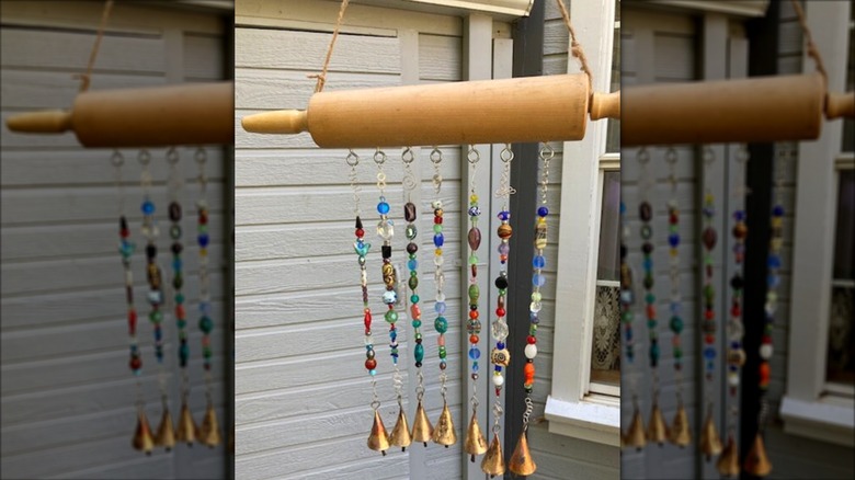 Rolling pin beaded wind chimes hanging outside