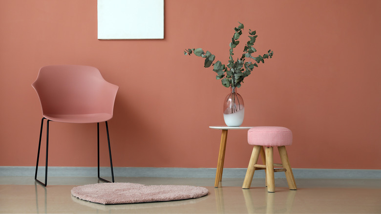 Matching furniture against red wall