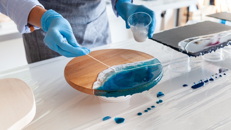 person making resin cutting board