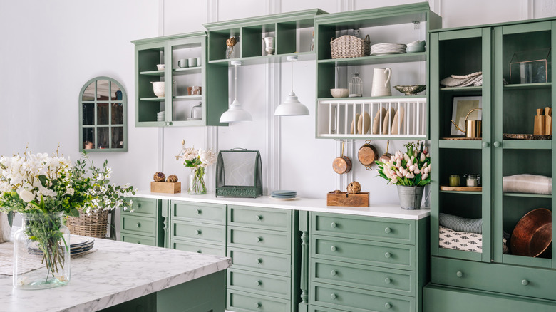 Moss green kitchen cabinetry