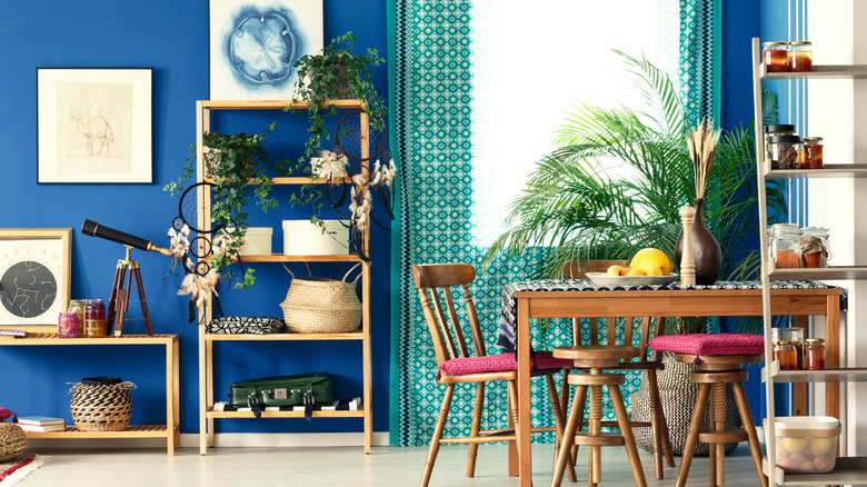 room with blue walls and wood furniture