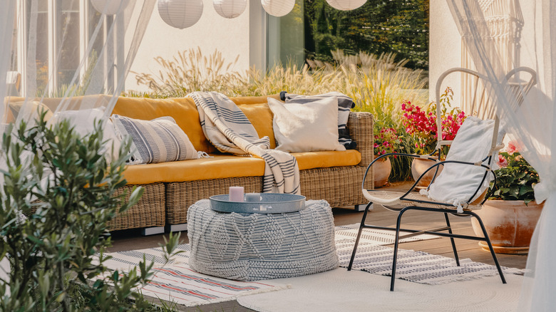 outdoor patio with a blue floor pouf