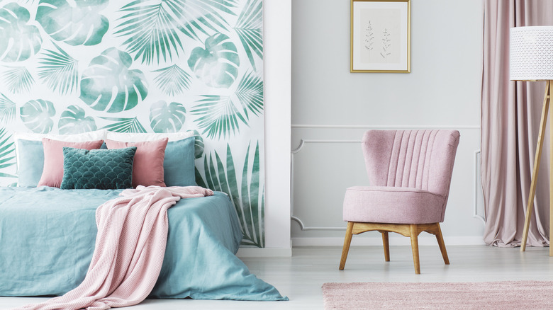 bedroom with leaf pattern accent wall