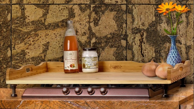 A bamboo stove cover sits on a range top