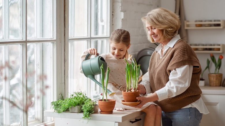 Woman and child with plants