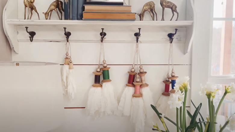 spool tassels hanging on hooks