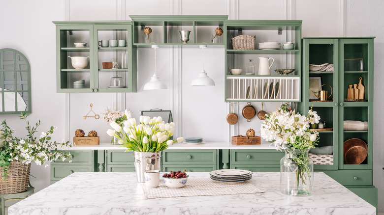 Green and white kitchen cabinets