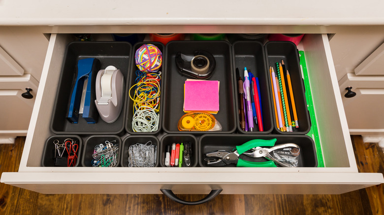 Drawer dividers with office supplies