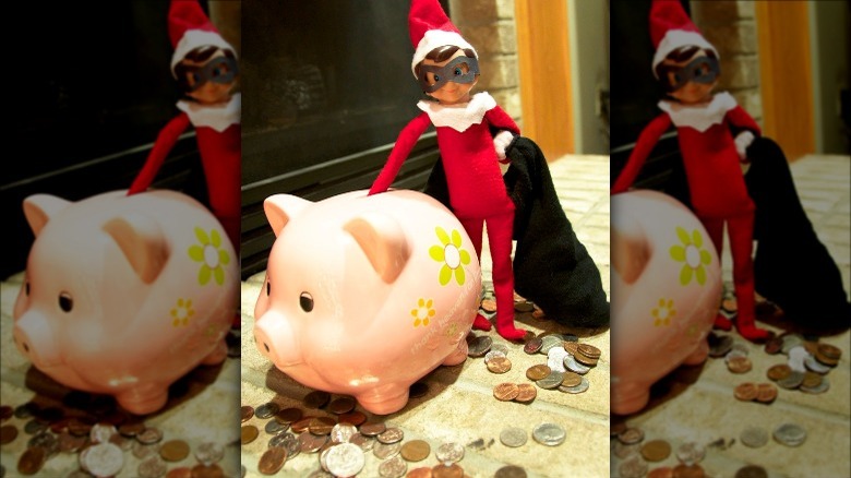 Elf robbing piggy bank