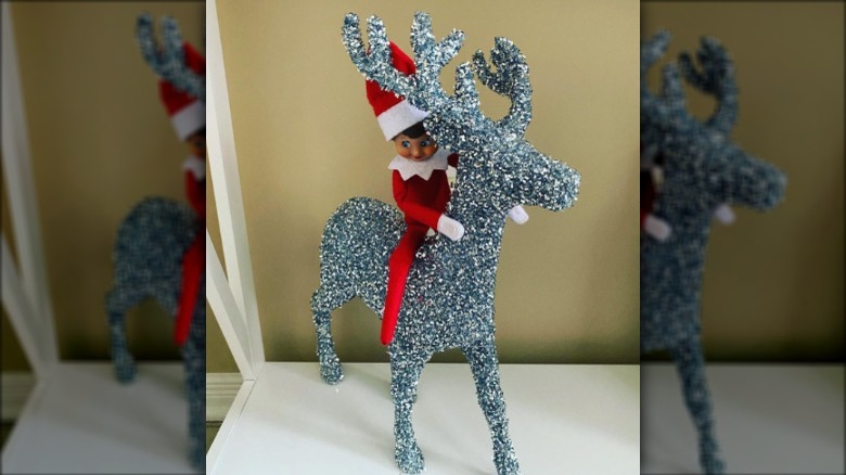 Elf riding glitter deer