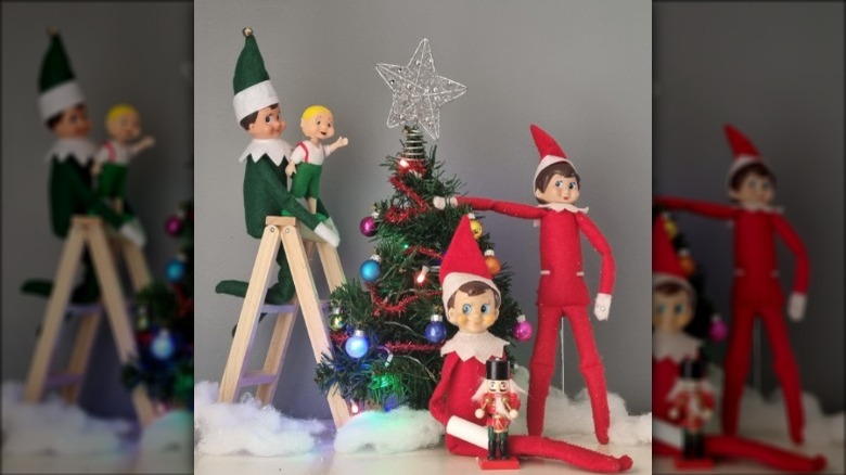 Elves decorating Christmas tree